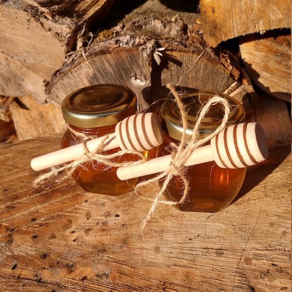 Raw unfiltered wildflower honey from Vermont in a 3 oz. glass jar with honey dipper