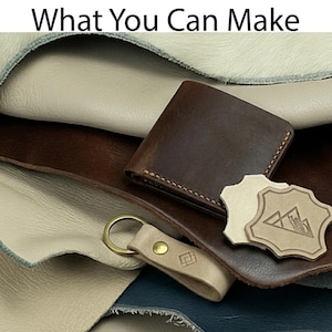 May include: A collection of leather goods, including a brown leather wallet, a beige keychain with a gold ring, and a beige leather tag with a mountain design. The text "What You Can Make" is at the top.