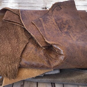 Cowhide Leather Remnants Upholstery Material Supply Natural Brown Leather Various Sizes Available Medium Thickness Hide Perfect Repair Projects Multiple Pieces Included Genuine Leather Collection DIY Craft Material Quality Leather Scraps