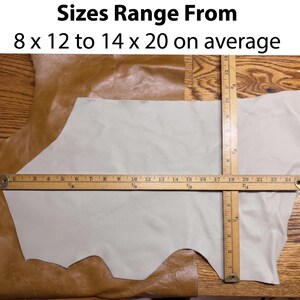 May include: Tan and off-white leather pieces with a wooden ruler showing measurements. The text at the top reads "Sizes Range From 8 x 12 to 14 x 20 on average."