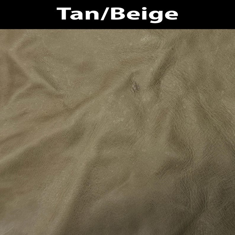 K&ouml;nnte beinhalten: Ein strukturiertes Material in Beige und Hellbraun mit nat&uuml;rlicher Maserung und sichtbaren Falten. Die Oberfl&auml;che hat ein mattes Finish mit subtilen Farbnuancen. Der Text Tan/Beige ist in Wei&szlig; auf einem schwarzen Balken oben abgebildet.
