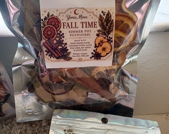 May include: A clear, resealable pouch containing a simmer pot potpourri mix labeled Yemis Moon Fall Time. The contents include dried orange slices, cinnamon sticks, cloves, star anise, bay leaves, and apple slices visible through the plastic.