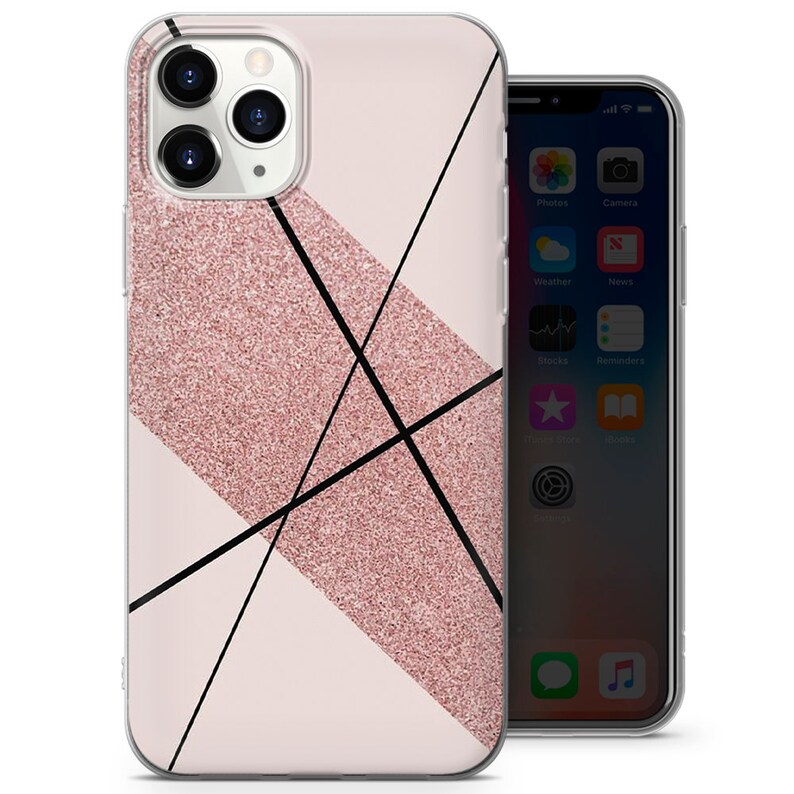 May include: A clear phone case with a pink glitter design and black lines. The case is designed for an iPhone with a camera bump.