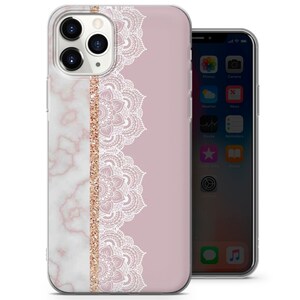 May include: A clear phone case with a pink background and a white marble design on the left side. A white lace pattern is on the right side with a gold glitter stripe in between.