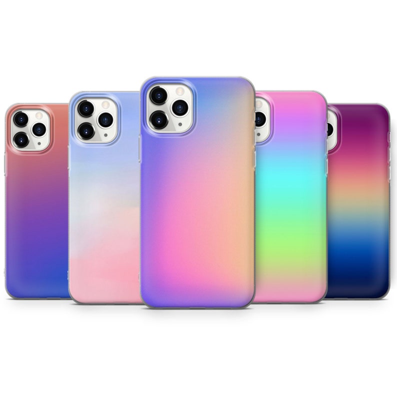 May include: Five different colored phone cases with a gradient effect. The cases are clear and show the phone's camera lenses. The colors are pink, blue, purple, green, and orange.