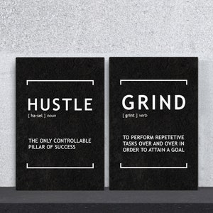 May include: Two black framed motivational posters with white text. The left poster says "Hustle [ha-sel] noun The only controllable pillar of success". The right poster says "Grind [grint] verb To perform repetitive tasks over and over in order to attain a goal".