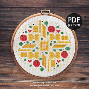 May include: A cross-stitch pattern featuring pasta shapes, tomatoes, and green accents in a circular design. The design is set in a wooden embroidery hoop. The text "PDF pattern" is in a black circle. The artist's name and shop URL are at the bottom.
