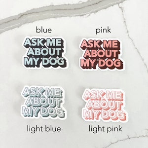 Four stickers reading ask me about my dog labeled for their different colors, including blue, pink, light blue, and light pink with marble background