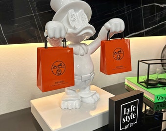 Scrooge Duck (Skulptur) Pop Art Goldstatue Alec Monopoly inspirierte Bärenziegelsteinstatue orange grün Luxus coole Kunst