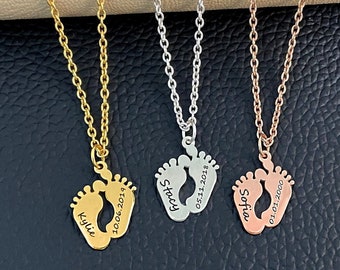 May include: Three gold, silver, and rose gold necklaces with baby footprints pendants. Each pendant has a name and date engraved on it. The names are Kylie, Stacy, and Sofie.