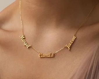 May include: Gold necklace with three names, "Margat", "Camilla", and "Jaacan", spelled out in cursive.