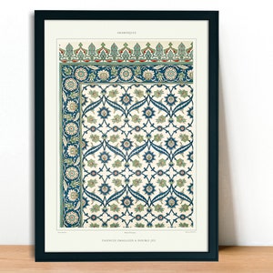 May include: Framed print featuring an intricate floral pattern in shades of blue, green, and cream. The design includes stylized flowers and leaves, with a decorative border. The print is labeled "ARABESQUE" at the top.