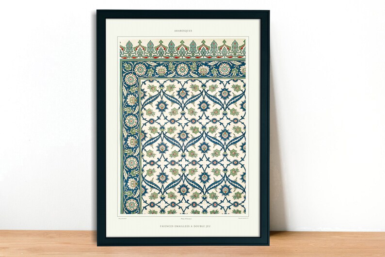 May include: Framed print featuring an intricate floral pattern in shades of blue, green, and cream. The design includes stylized flowers and leaves, with a decorative border. The print is labeled "ARABESQUE" at the top.