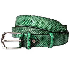May include: A bright green belt featuring a textured snakeskin pattern throughout the strap. The belt includes a polished silver-tone metal buckle and a matching green leather keeper loop with a small silver stud detail near the buckle.