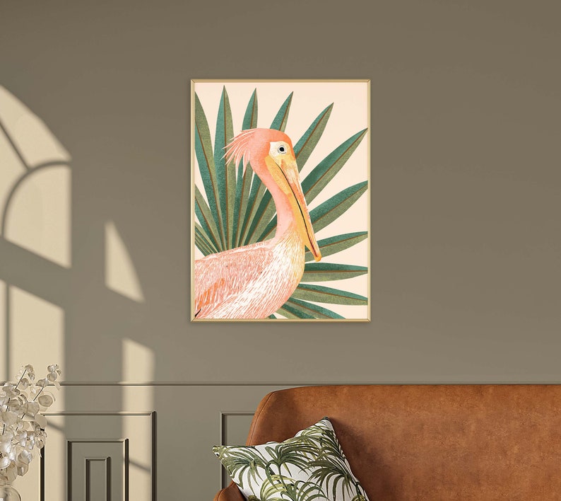 May include: A pink pelican with a long beak is depicted in a tropical setting with green palm leaves. The pelican is facing to the right and the leaves are behind it. The background is a light peach color.