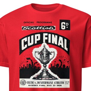 May include: Red t-shirt featuring a vintage design for the Scottish Cup Final. The graphic includes a trophy, the words "CUP FINAL", and the text "CELTIC v. DUNFERMLINE ATHLETIC HAMPDEN PARK MAY 23 2026". The shirt also has the text "OFFICIAL PROGRAMME" and "Scottish".