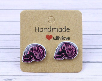 May include: A pair of pink skull-shaped earrings with the text "Where's My Mind?" printed on them. The earrings are on a brown card with the text "Handmade with Love".