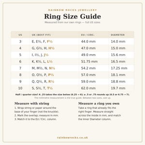 May include: A beige ring size guide chart titled Rainbow Rocks Jewellery. It displays a table with columns for US, UK, EU circumference, and diameter in millimeters. Instructions for measuring with string or an existing ring are provided below.