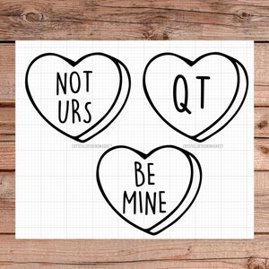 May include: Three black and white outline heart-shaped candy conversation hearts with the text "NOT URS", "QT", and "BE MINE".