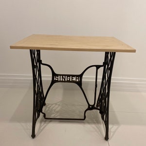 Singer Sewing base refinished with a fine wooden table top