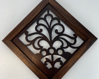 Walnut cutout framed in mahogany