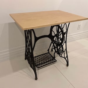 Singer Sewing base refinished with a fine wooden table top