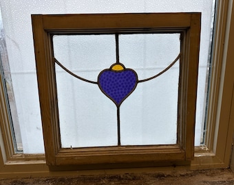 Early 1900s English window with stained glass detail