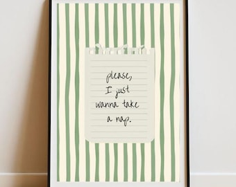 May include: Framed art print with a black border. The background features vertical green stripes. A torn paper note is centered, displaying the handwritten text: "please, I just wanna take a nap."