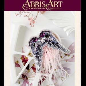 Angel Wings beaded brooch styled flat-lay showing crystal heart and bugle bead texture