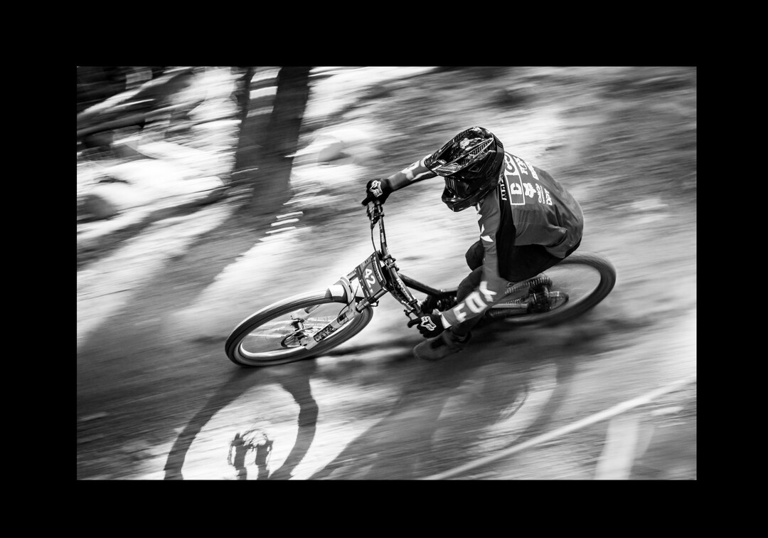 Downhill Mountain Bike Racing Black and White Photo Featuring a