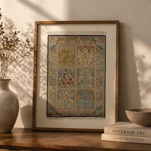 May include: A framed artwork with a traditional design. The artwork features a rectangular pattern with various square and rectangular panels, each containing intricate floral and geometric patterns in shades of blue, gold, and red. The frame is a warm brown colour.