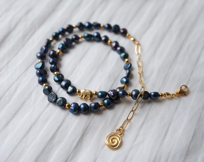 dark blue freshwater pearl necklace with gilded elephant and spiral pendant