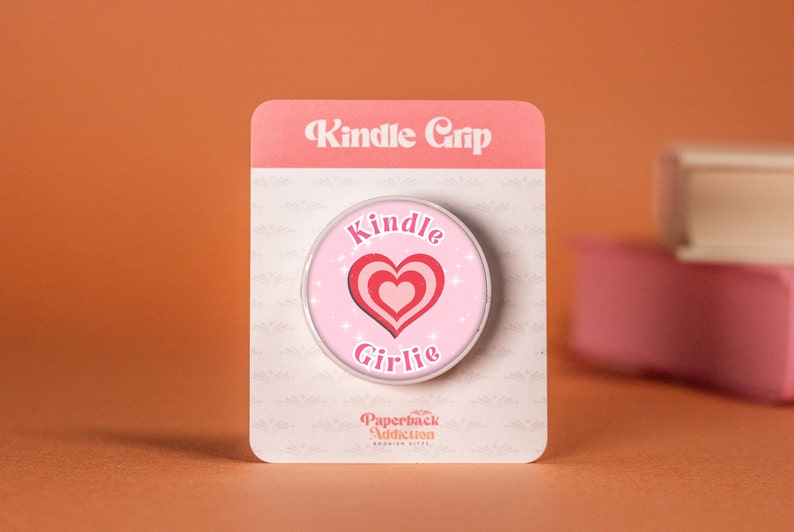 Pink kindle grip with love hear and 'Kindle Girlie' in text.