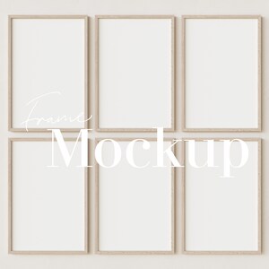 May include: Six empty wood picture frames with a white background. The frames are arranged in a grid pattern with three frames in each row. The frames are all the same size and have a simple, modern design.