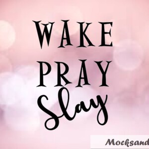 May include: A pink and white blurred background with the text "WAKE PRAY SLAY" in black.