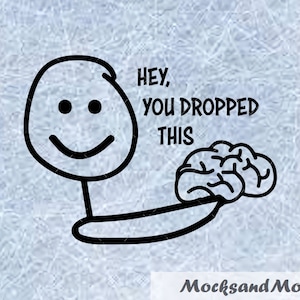 May include: A black and white stick figure with a smiling face holding a brain, with the text "HEY, YOU DROPPED THIS". The image has a light blue background and the text "MocksandMore" at the bottom.
