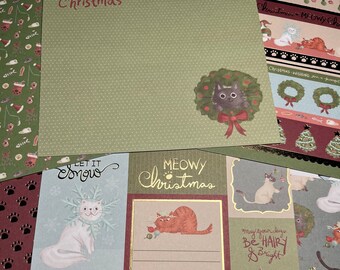 May include: A set of Christmas themed paper crafting supplies featuring cats. The papers have a variety of designs including a cat wearing a Santa hat, a cat in a stocking, a cat in a wreath, and a cat with a Christmas tree. The papers also have the text "Let it Snow", "Meow Christmas", "Feline Festive", "Santa Paws", and "May your days be hairy & bright".