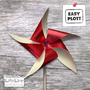 May include: A red and white paper pinwheel with a glittery finish. The pinwheel is attached to a wooden stick. The text "EASY PLOT" is visible on a white note.