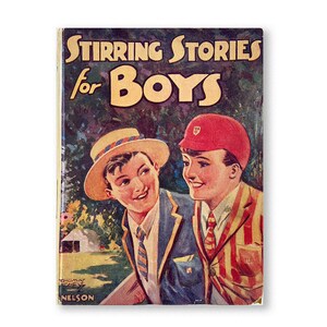 May include: A vintage book cover with the title "Stirring Stories for Boys" in yellow lettering. The cover features two boys in school uniforms, one wearing a straw hat and the other a red cap. The background is a green and brown landscape.