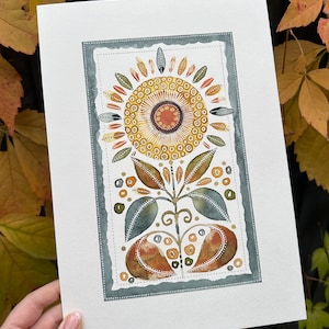 May include: A watercolor painting of a stylized flower with a yellow center and green leaves. The flower is surrounded by a decorative border in shades of green and brown.
