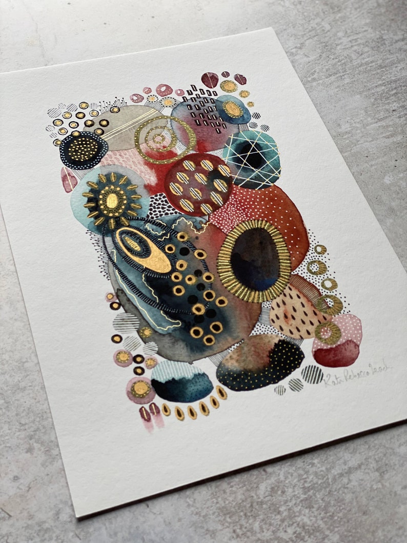 May include: Abstract watercolor painting with gold accents. The painting features a variety of shapes and patterns, including circles, dots, and lines. The colors are mostly red, blue, and gold.