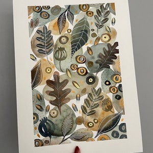 May include: A watercolor painting featuring a pattern of leaves, flowers, and abstract shapes in shades of green, brown, and gold.