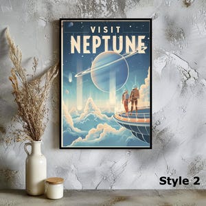 May include: A framed poster with a retro-style illustration of Neptune. The artwork features a large planet with rings, two figures in space suits, and the words "VISIT NEPTUNE". The color palette includes blues, oranges, and whites.
