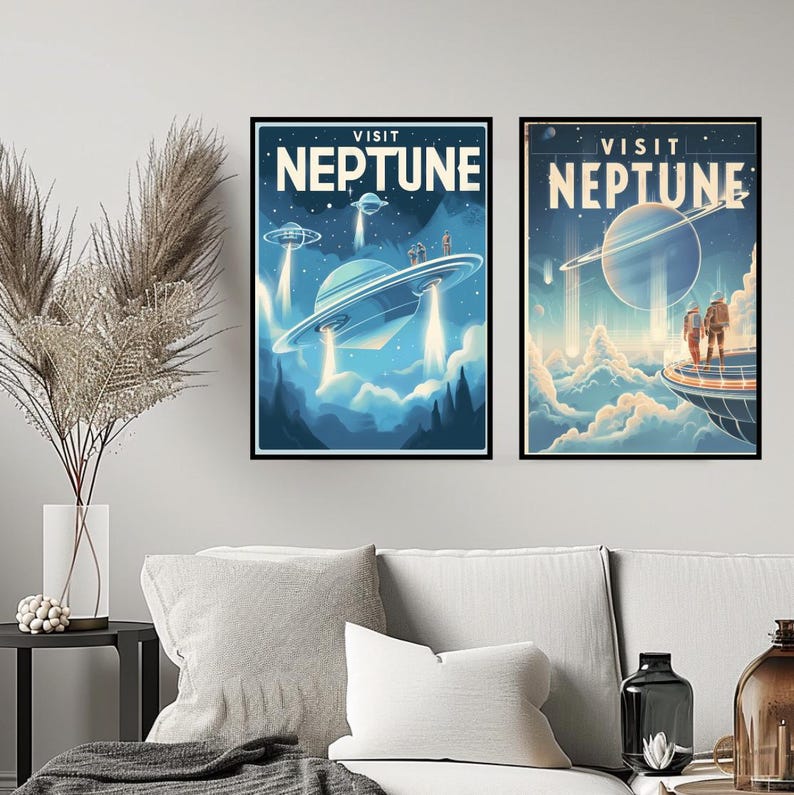 May include: Two framed art prints with a retro space travel theme. The prints feature the words "VISIT NEPTUNE" above images of flying saucers and a planet with rings. The color palette is primarily blue and white.