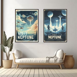 May include: Two framed art prints with a retro space travel theme. Each print features a dark blue background with illustrations of planets, spaceships, and astronauts. The text "VISIT NEPTUNE" is prominently displayed on each print.