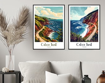 May include: Two framed prints of the Cabot Trail in Nova Scotia, Canada. The prints feature a scenic coastal road winding through a lush green landscape with a blue ocean in the background. The text "Cabot Trail" and "Canada" is printed below each image.