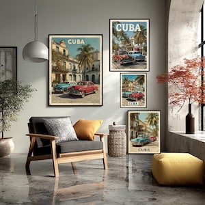 May include: A set of framed art prints depicting classic cars in Cuba. The prints show vintage cars in red and blue, with the word "CUBA" at the top. The artwork is displayed in a living room setting with a modern armchair and a yellow footstool.