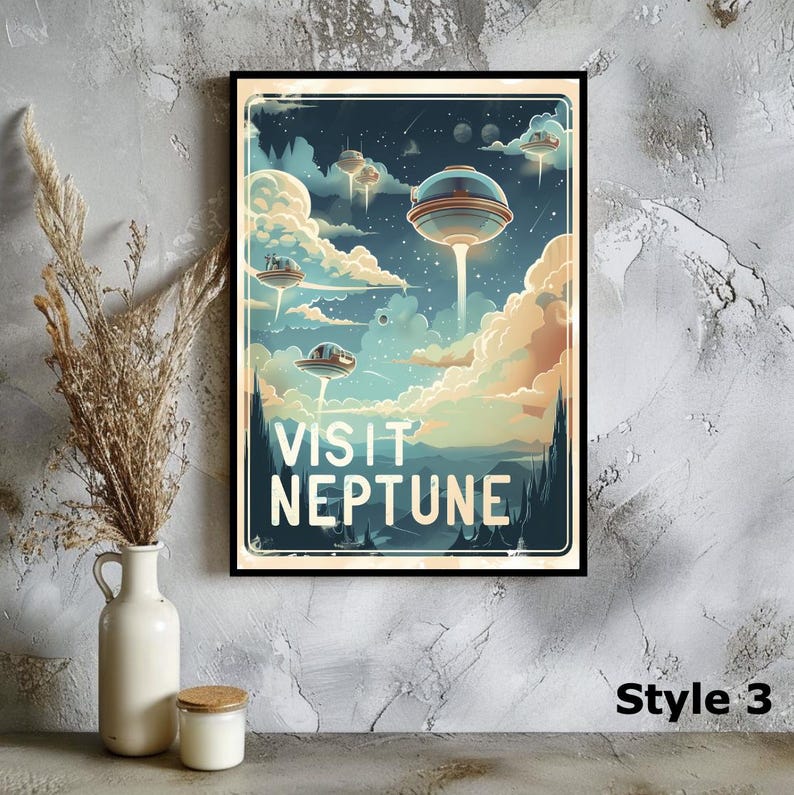 May include: A framed art print with a retro-style illustration of flying saucers above a planet. The artwork features the text "VISIT NEPTUNE" in a vintage font, set against a backdrop of clouds and a night sky. The print is displayed on a wall with a vase and candle.
