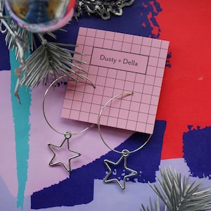 Silver star skinny hoop statement earrings