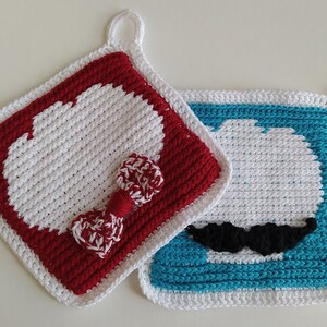 May include: Two handmade crochet potholders. One is red and white with a bow, the other is blue and white with a black mustache. Both have a white border and a loop for hanging.